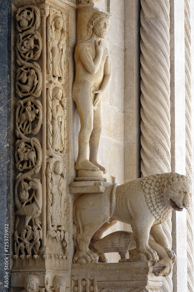 Sculptures at the entrance to Trogir cathedral, Croatia.