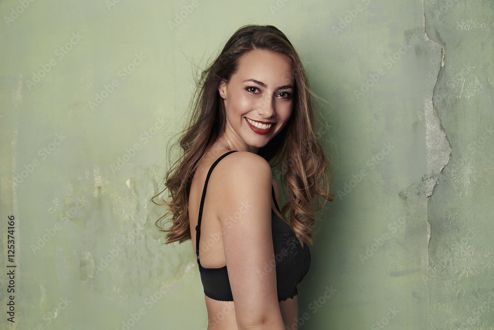 Stunning underwear model smiling at camera