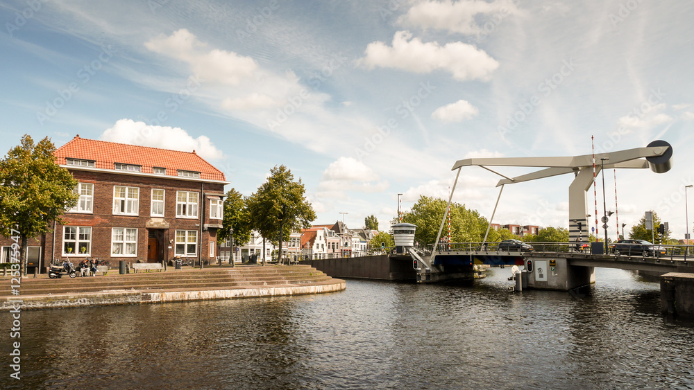 Fototapeta premium Modern Drawbridge spanning the River Spaarne in Haarlem, Netherlands.