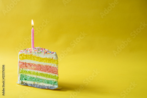 rainbow butter cake over yellow background