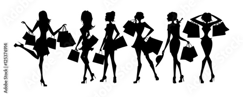 Shopping sillhouettes set. Black sillhouettes of women with shopping bags on white background. Elegant, young and slim women.