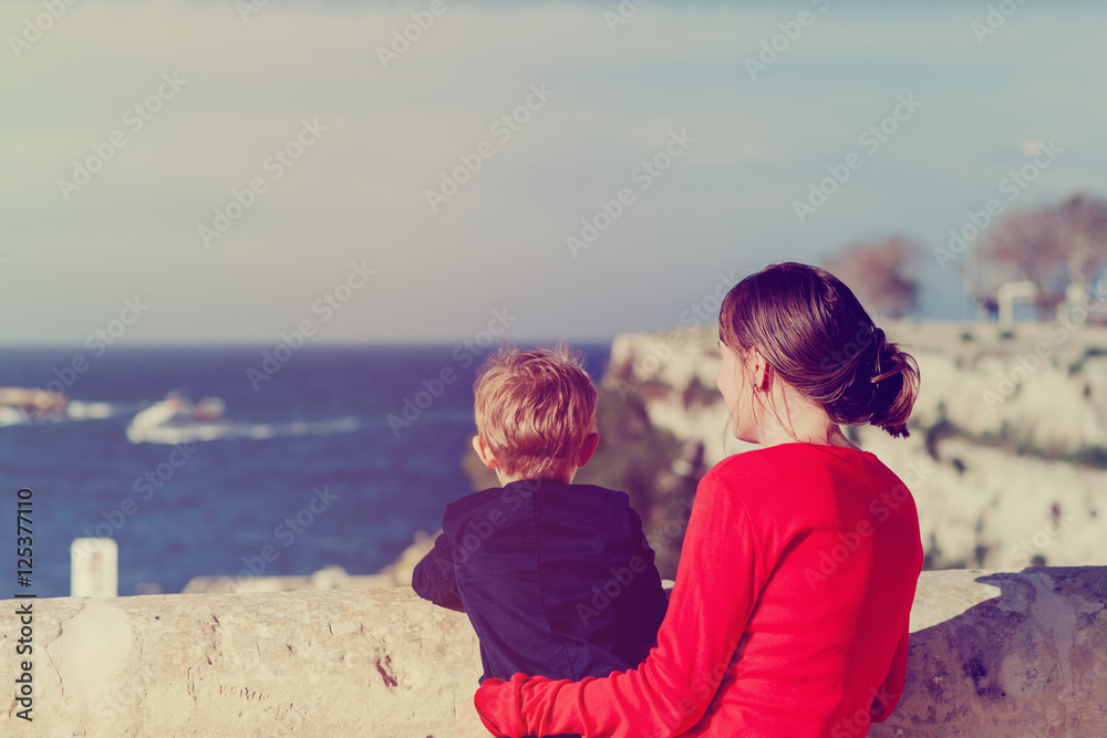 mother and little son looking at sea view, family travel Europe mother and little son looking at sea view, family travel Europe
