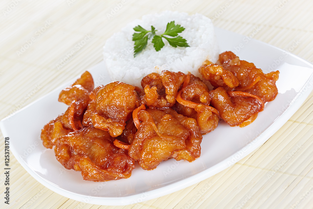 Chinese cuisine. Pork in batter and sweet and sour sauce Chinese cuisine. Pork in batter and sweet and sour sauce
