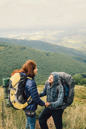 Man is making proposal in the mountains