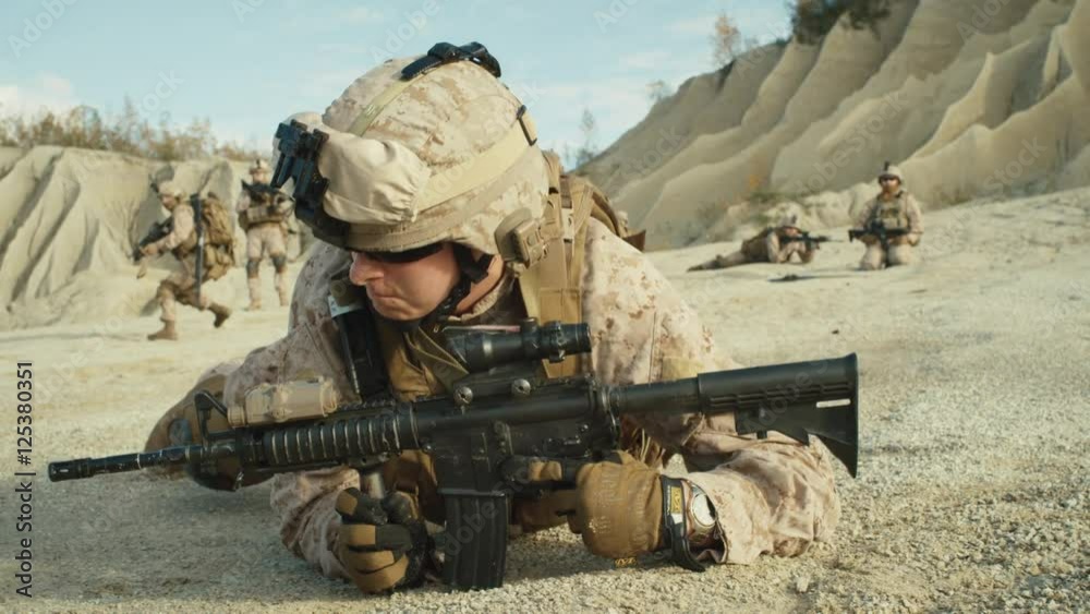 Follow Shot of Squad of Soldiers Running Forward During Military Operation in the Desert. Slow motion. Shot on RED EPIC Cinema Camera in 4K (UHD). Follow Shot of Squad of Soldiers Running Forward During Military Operation in the Desert. Slow motion. Shot on RED EPIC Cinema Camera in 4K (UHD).