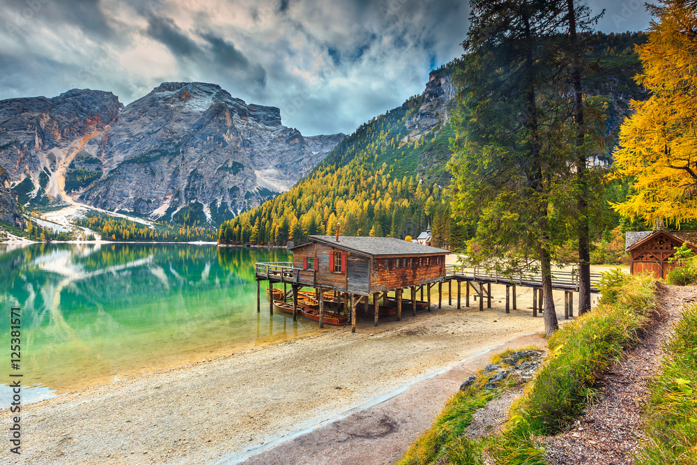 Spectacular wooden boathouse on the alpine lake,Dolomites,Italy,Europe