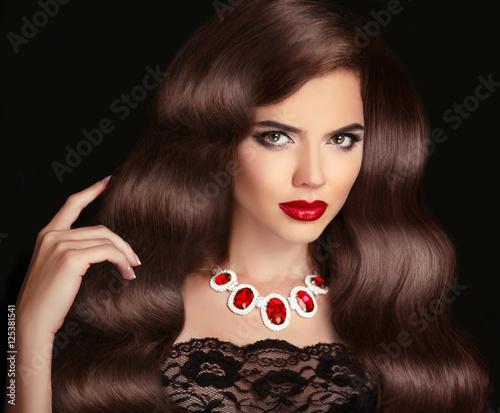 Wavy Hair. Beautiful Brunette Woman. Red Lips makeup. Healthy Lo