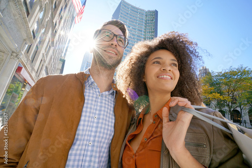 Cheerful couple doing shopping in New York city