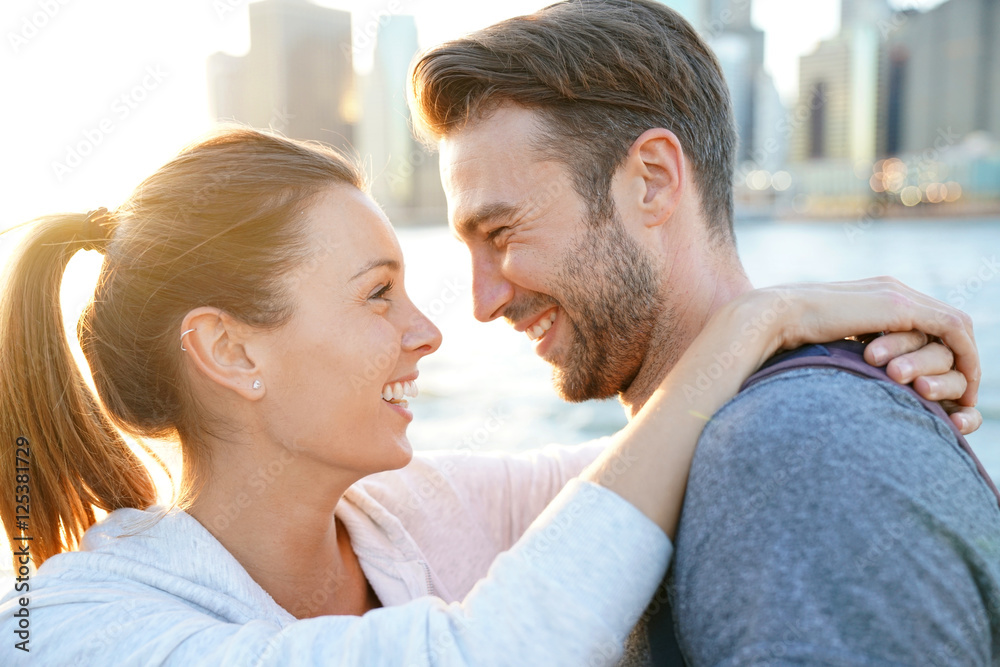 Fototapeta premium In love couple enjoying sunset on Brooklyn heights, NYC