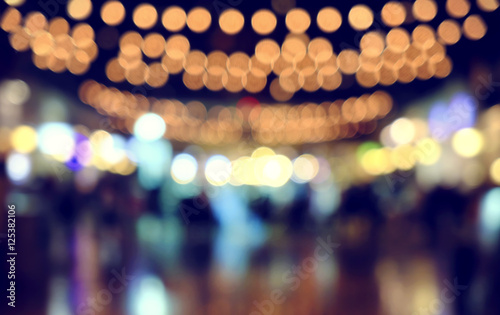 image of wooden table in front of abstract blurred background