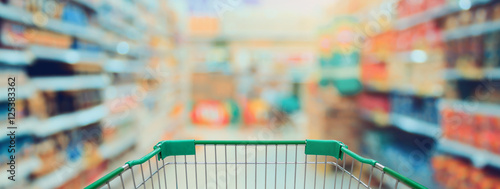 Shopping in Supermarket with shopping cart photo