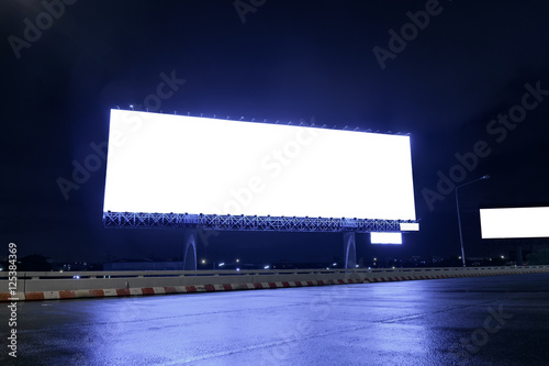 Billboard / View of empty billboard at night for advertisement.