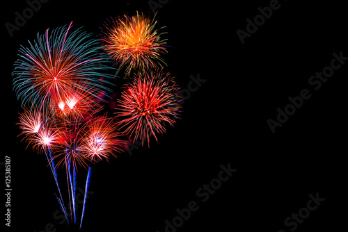 colorful fireworks - beautiful colorful firework isolated display for celebration happy new year and merry christmas on black isolated background