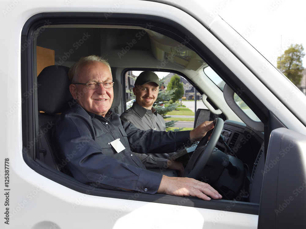 Group of delivery man in a car. Group of delivery man in a car.