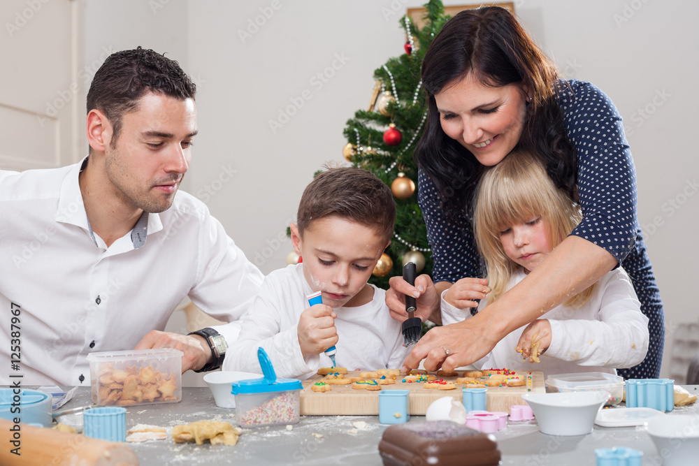 family decorates christmas cookies family decorates christmas cookies