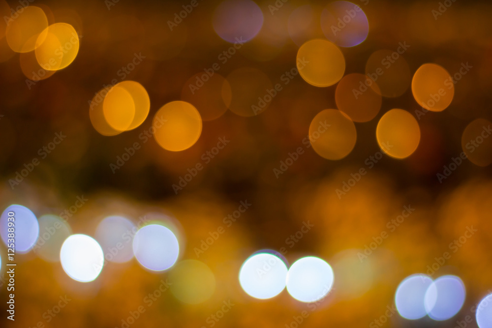 Abstract defocused white and golden light bokeh for background