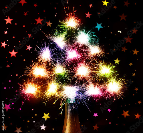  Christmas New Year's  tree form fireworks  sparks on hearts  dark background from the bottle chmpagne photo