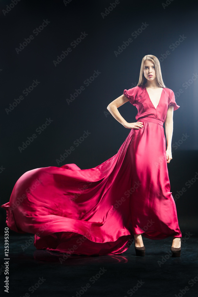 Attractive young woman in elegant long pink dress Attractive young woman in elegant long pink dress