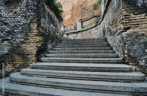 Wall made of brick and stone stairs in the old town in Poznan.
