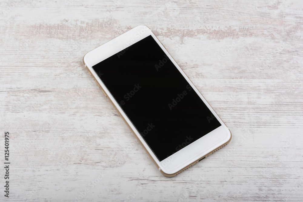 Modern touch screen smart phone on white wooden background Modern touch screen smart phone on white wooden background