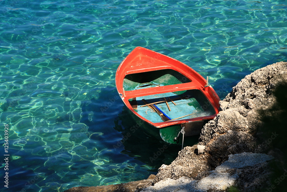 Fototapeta premium Small orange boat in Adriatic sea , Croatia moments
