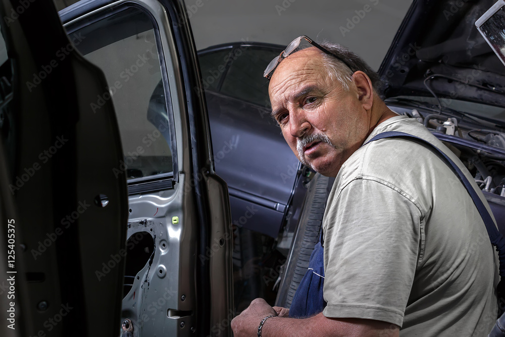 portrait of an elderly mechanic