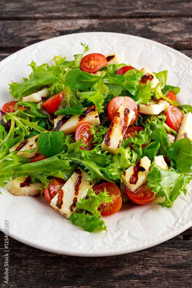 Grilled Halloumi Cheese salad witch tomatoes and lettuce. healthy food Grilled Halloumi Cheese salad witch tomatoes and lettuce. healthy food