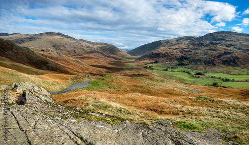 The view from the top of the Hardknott Pass in Cumbria one of Britain's steepest & most treacherous roads with gradients of 33% & hairpin bends, looking out over the Duddon Valley to the Wrynose Pass photo