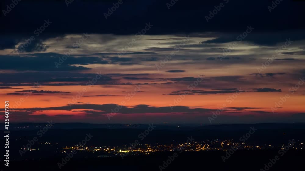 4K. Night Traffic and Moving Clouds Time Lapse Beautiful Color. Left to right pan. UHD 4K. Night Traffic and Moving Clouds Time Lapse Beautiful Color. Left to right pan. UHD