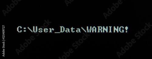 Computer screen shot of black background and white warning security text
