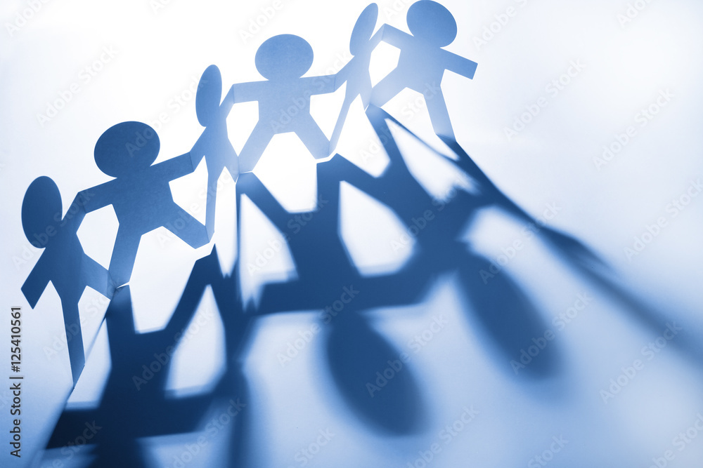 Paper chain team holding hands united Paper chain team holding hands united