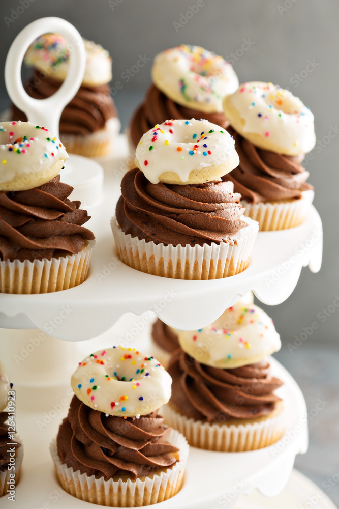 Cupcakes with chocolate frosting and little donuts