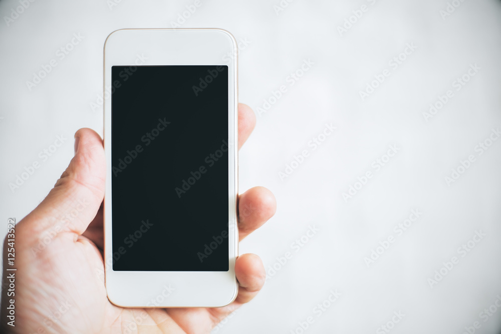 Hand holding cellphone Hand holding cellphone