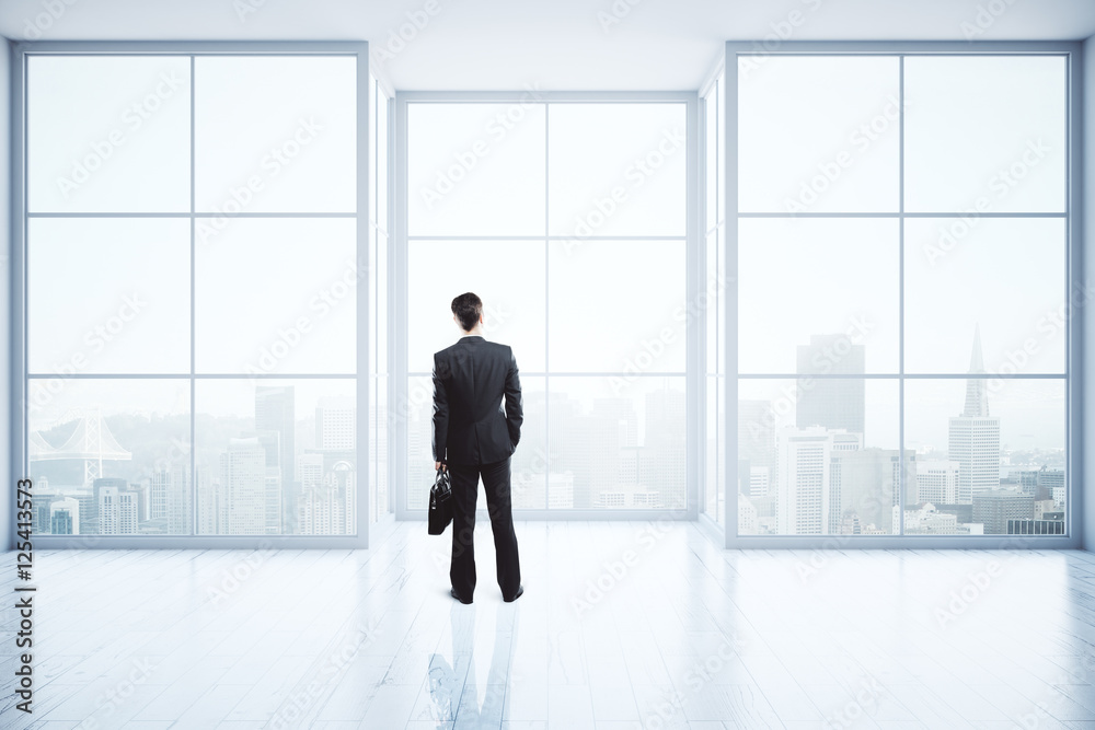 Businessman in empty interior Businessman in empty interior