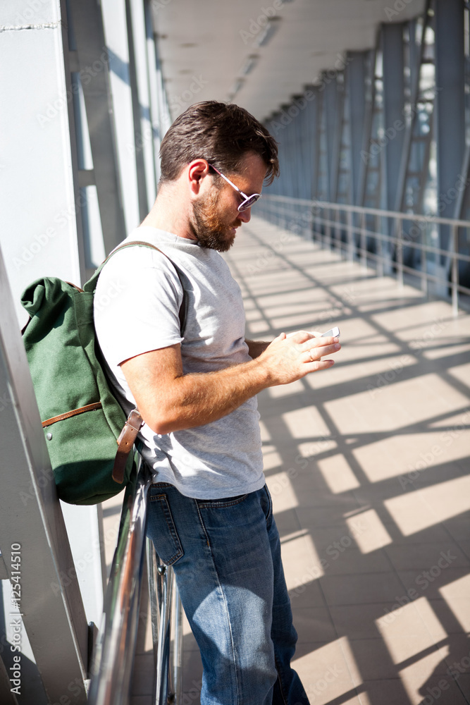 man waiting for his flight in the airport and calling man waiting for his flight in the airport and calling