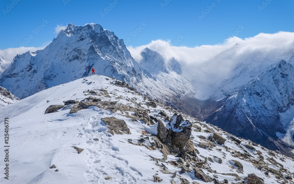 Mountain landscape in the mountains. View of the mountain peaks of the Main Caucasus Range in Dombai