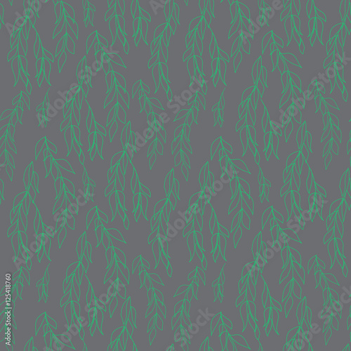 Green willow branches on gray background