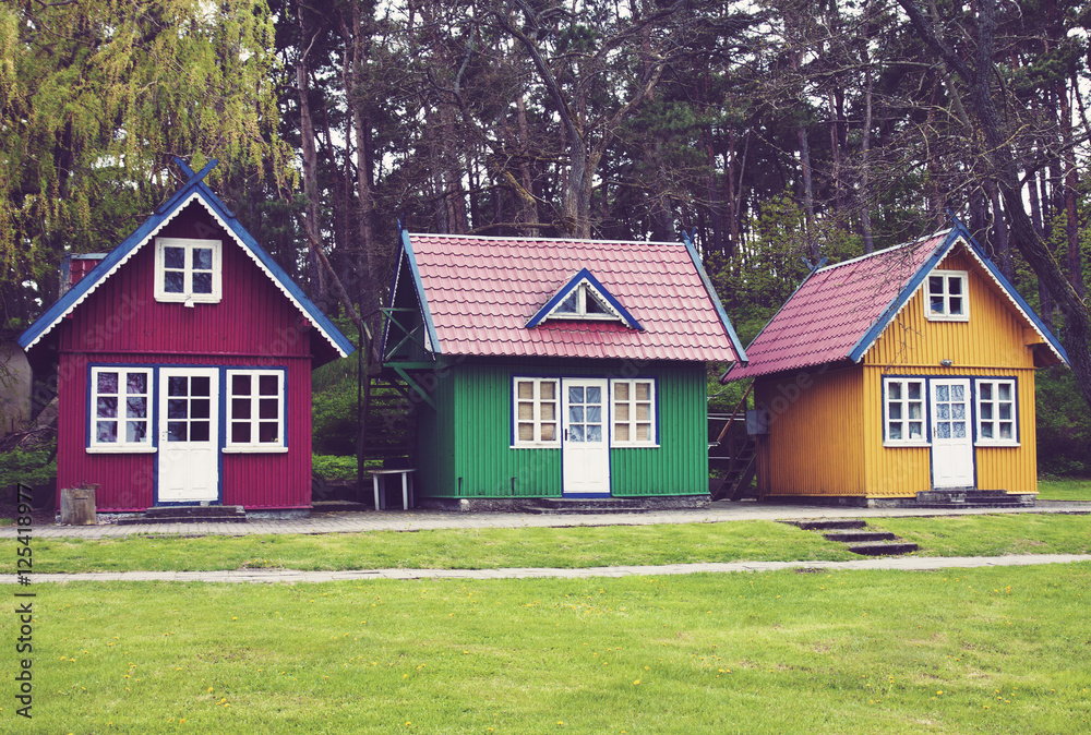 Three empty colorful summer houses in Nida, Lithuania