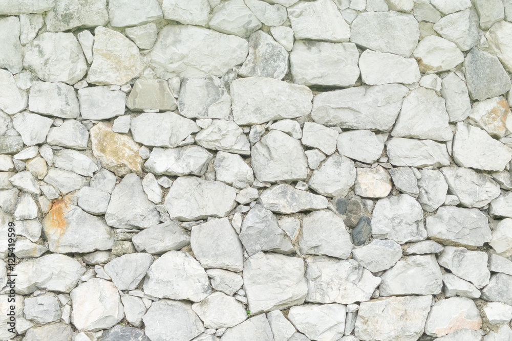 Texture of old rock stone wall of background