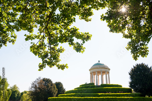 The small temple in Querini park, Vicenza, seen from some backlit trees photo