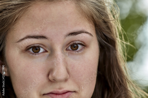 Head Shot of Young Woman with Tear on Face