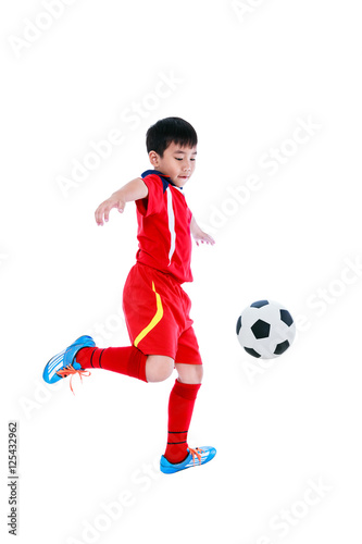 Obraz na płótnie Young asian soccer player with soccer ball. Studio shot. w salonie