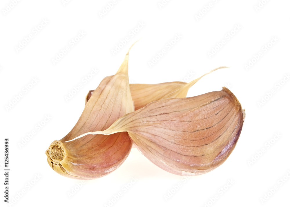 Obraz premium Three garlic cloves isolated on white background