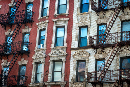 Facade of apartment buildings in New York City with red and white bricks