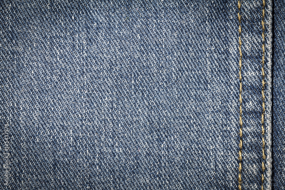 Denim jeans texture or denim jeans background with seam. Old grunge vintage denim jeans. Stitched texture denim jeans background of fashion jeans design. Denim jeans texture or denim jeans background with seam. Old grunge vintage denim jeans. Stitched texture denim jeans background of fashion jeans design.