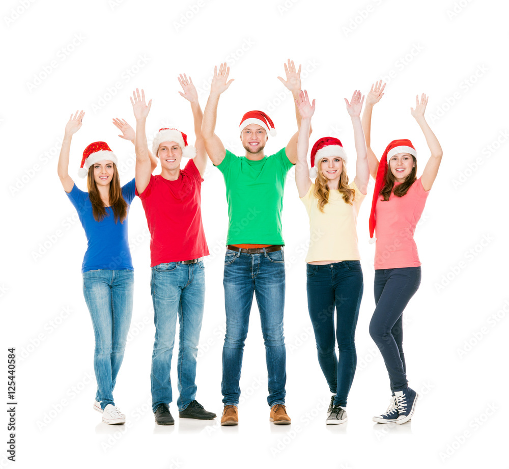 Group of smiling friends in Christmas hats Group of smiling friends in Christmas hats