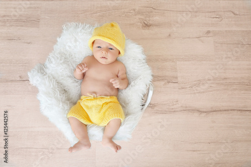 Cute baby lying on fluffy p...