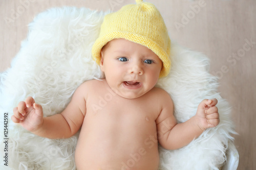 Cute baby lying on white fl...