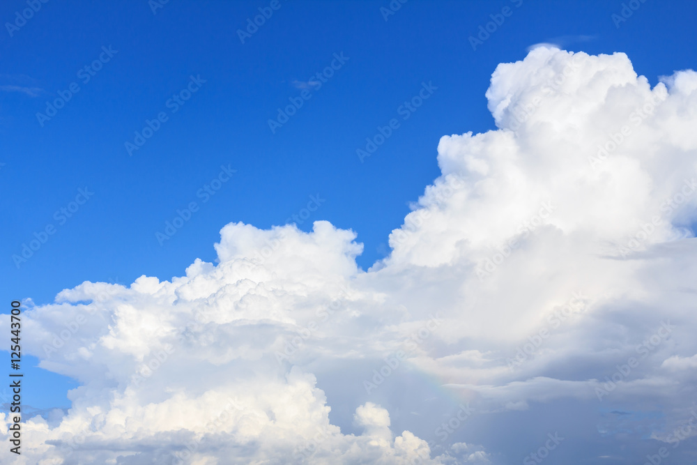 Blue sky background with white clouds and rain clouds. The vast blue sky and clouds sky on sunny day. White fluffy clouds in the blue sky. Blue sky background with white clouds and rain clouds. The vast blue sky and clouds sky on sunny day. White fluffy clouds in the blue sky.