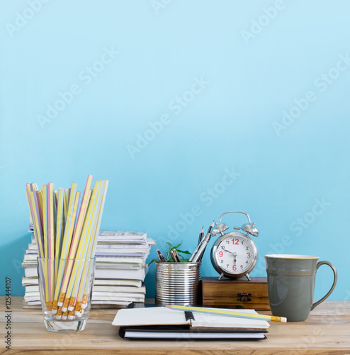 Office table with blank notepad, workplace in room. Creative off photo